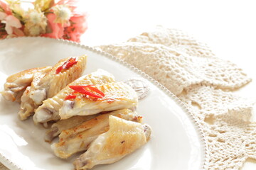 Barbecue grilled chicken wings and chili pepper 