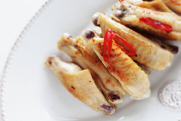 Barbecue grilled chicken wings and chili pepper 