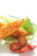 Homemade deep fried prawn served with cherry tomato for Japanese food image