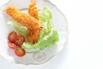 Homemade deep fried prawn served with cherry tomato for Japanese food image