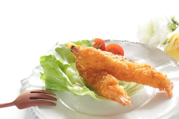 Homemade deep fried prawn served with cherry tomato for Japanese food image