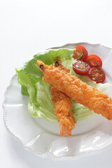 Homemade deep fried prawn served with cherry tomato for Japanese food image