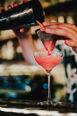 man hand bartender making sweet and sour refreshing cocktail on the bar counter