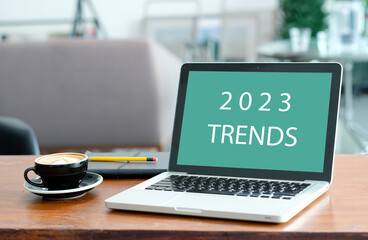 Laptop computer with 2023 trends on screen background, digital marketing, business and technology...
