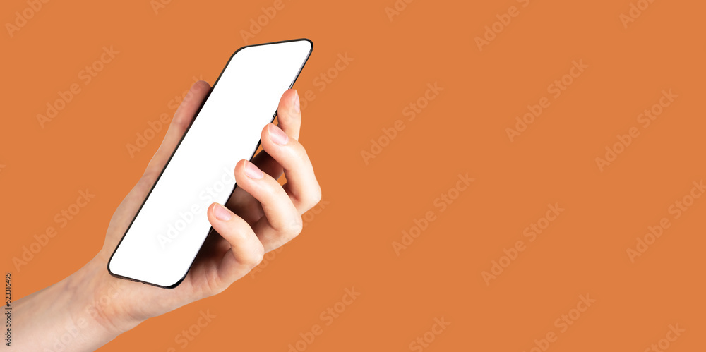 Poster banner with hand holding phone mockup on orange background. angled view. android template with white