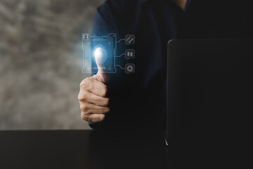 Businessman with a laptop, hologram icon fingerprint encryption, protecting access to confidential information by using fingerprint technology. Fingerprint encryption concept. Fingerprint login.