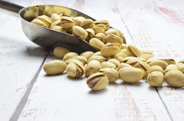 Close up, dried fruit, pistachio on rustic table.	