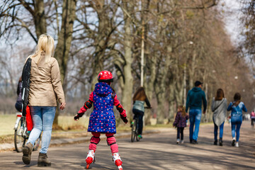 Young happy skater trying exciting outdoor activity.