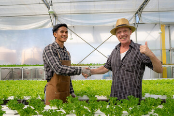 Handshake of business partners, farmers