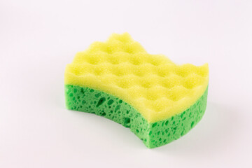 Yellow- green sponge for washing dishes close-up