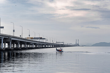 Sunrise shoot under the Penang Bridge. Penang bridges are crossings over the Penang Strait in Malaysia. They connect the area of Seberang Perai on the Malay peninsula with the island of Penang.