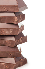 chocolate pieces. dark chocolate bars stacked high