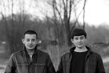Portrait of two twin brothers in black and white