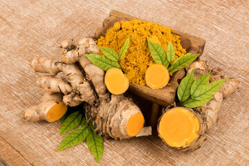 Curcuma aromatica or wild turmeric rhizome on an old background.