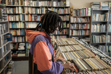 Woman searching through vinyl records