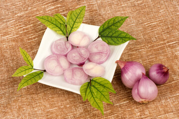 Red shallots on an old wood background.