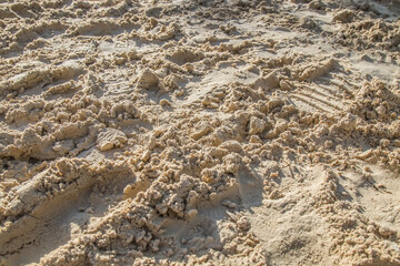 Wet loose sand in nature on the beach