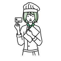 立って書類とカードを手に持つ調理師の女性