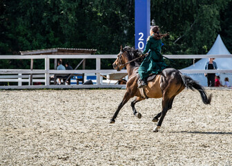 ancient equestrian game - kiss the bride - at the equestrian festival in summer