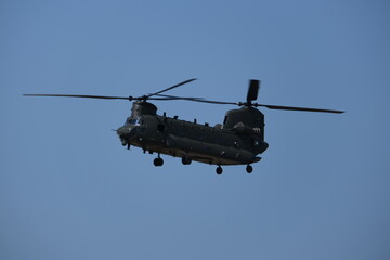 Fototapeta na wymiar Rotor Power: Thrilling Flight of a Chinook Helicopter in Action