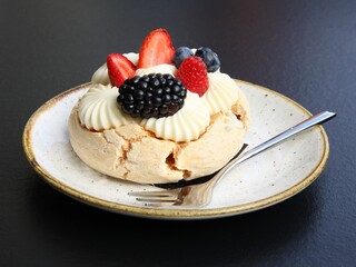 meringue cake with  with berries as dessert