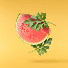 Fresh raw watermelon falling in the air isolated