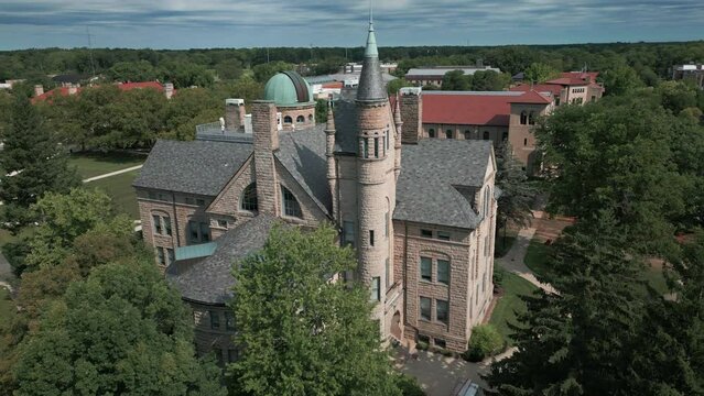 flying counter clockwise around Peters Hall at Oberlin College in Ohio