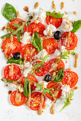 Traditional italian caprice salad tomato mozzarella cheese and basil