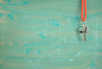 Whistle of soccer referee or trainer and soccer tactics scribble on green background. Great soccer...