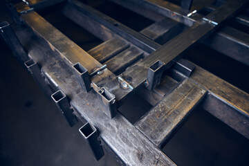 Industrial steel and metal works welded frame, welding iron and steel for construction and building. Solid cold hard metal frames and framework for structures and foundations for skyscrapers.