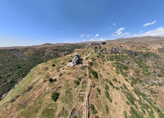 panoramic view of a mountain landscape with an old Christian church against the sky in Armenia taken from a drone
