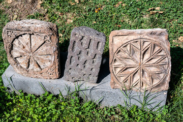 ancient stones, processed with ornaments and sacral signs, excavated in Armenia