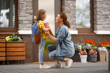 Parent and pupil going to school