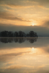 Fototapeta na wymiar Sun rising over Loch And in Scotland on a beautiful morning