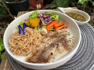 whole wheat noodles with fish and salad