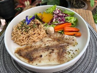 whole wheat noodles with fish and salad