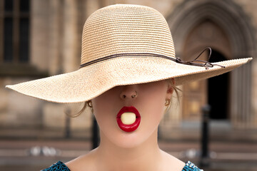 white chocolate between red lips