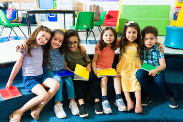 Multiracial preschoolers enjoying their education