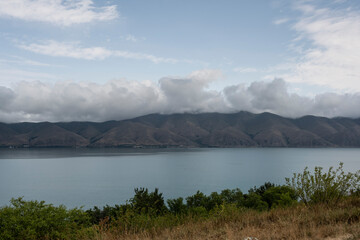 landscape with views of ancient stone buildings and temples on a summer day near Lake Sevan in Armenia