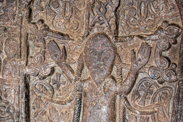 ancient Armenian bas-reliefs in temples on a religious theme, made with portraits of saints with features of the Mongoloid race