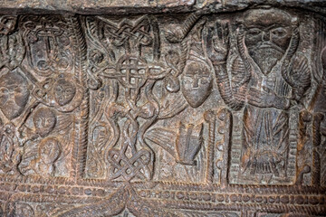 ancient Armenian bas-reliefs in temples on a religious theme, made with portraits of saints with features of the Mongoloid race