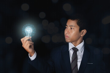 Businessman holding glowing light bulb with symbol brain and creative thinking ideas.