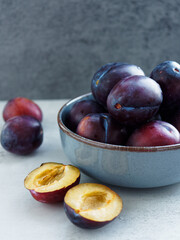 fresh plums in a bowl