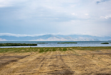 landscape with views of Lake Sevan and mountains and clouds on a summer day in Armenia