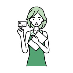 立って書類とカードを手に持つドレスの女性