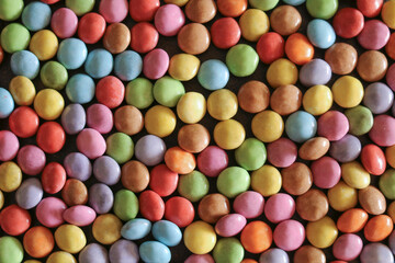 Colorful snapshot with multicilored chocolate dragee 