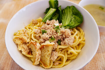 Bakmi or bami is a wheat based noodle cooked and served with chops of meats, vegetables usually bok coy and also wonton soup. It is famous in south east asia