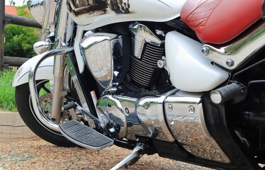 Chrome elements of a motorcycle standing in the parking lot
Chromowane elementy motocykla...