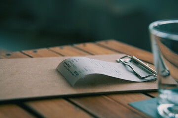 Fototapeta premium invoice bill ,Put on the dining table,in a restaurant,taken close-up.