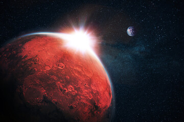 Amazing red planet Mars with craters and beautiful sunset rays in space with stars and blue planet Earth. Space Wallpaper Concept